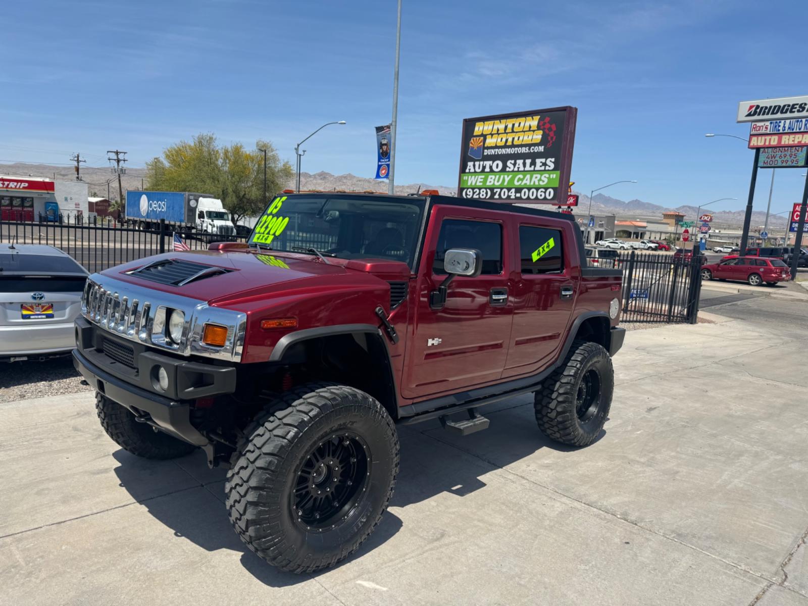 2005 Red /black Hummer H2 SUT , located at 2190 Hwy 95, Bullhead City, AZ, 86442, (928) 704-0060, 0.000000, 0.000000 - 2005 Hummer H2 SUT. only 92k miles. 6.0 V8 4 wheel drive. New transmission with warranty. New shocks. lots of extras .onstar. backup camera, custom stereo. fabtech 6 in lift with 40 in tires. Big Bad Hummer. $22900. Free and clear title. - Photo #1